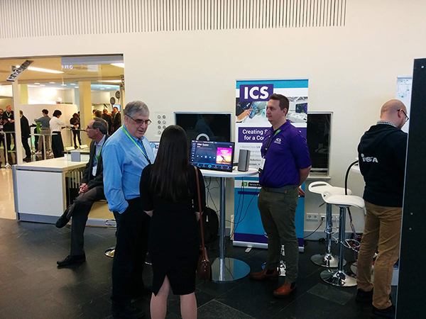 ICS CEO Peter Winston discussing design and development of embedded devices with a conference attendee.