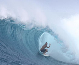 Surfer in pipeline