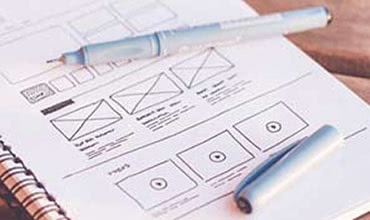 Wireframe sketches on notepad
