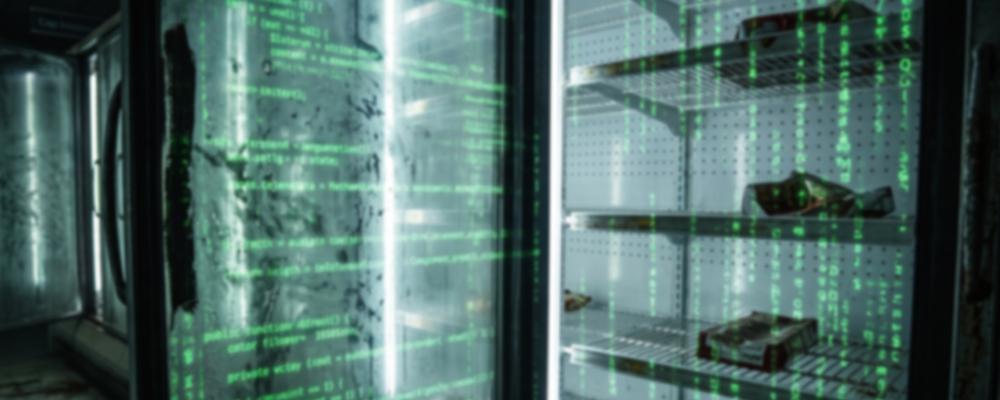 Grocery store refrigerator with glass doors displaying green digital code, shelves hold dark objects.